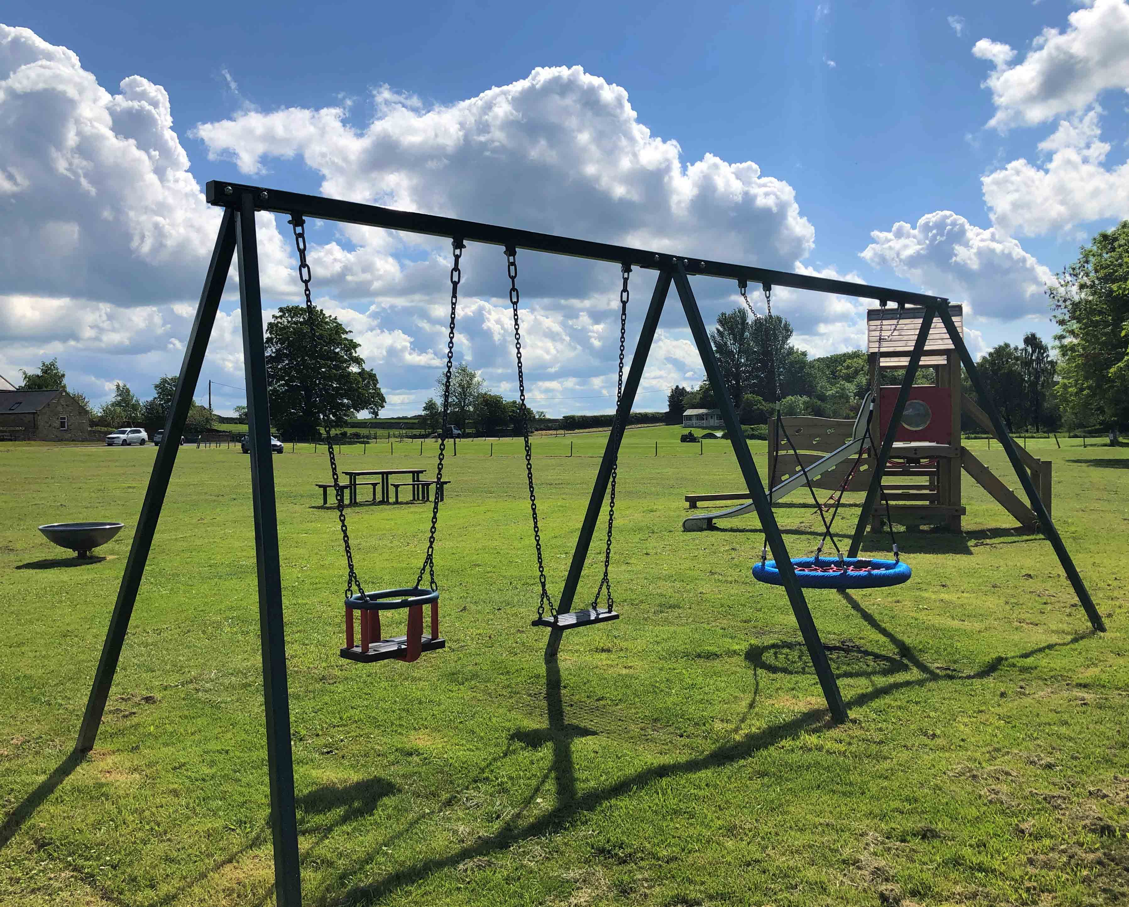 Sturdy Basket Swing with mixed seats Streetscape Products & Services
